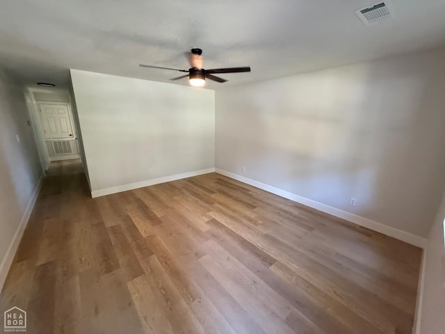2408 Harper St, Corning, AR 72422 - empty room with a ceiling fan and wood finished floors