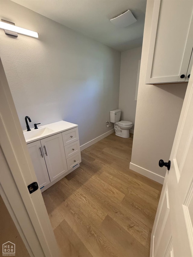 2408 Harper St, Corning, AR 72422 - bathroom with vanity and wood finished floors