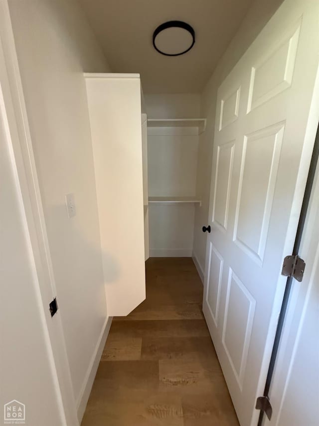 2408 Harper St, Corning, AR 72422 - hallway with light wood-style floors and baseboards