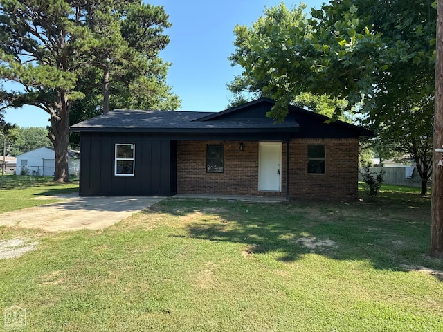 2408 Harper St, Corning, AR 72422 - view of front facade featuring board and batten siding and brick siding
