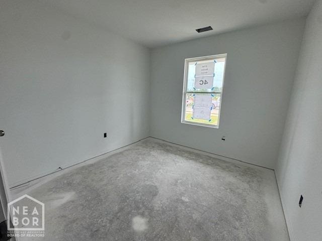 5706 Boone St, Jonesboro, AR 72404 - spare room with concrete floors