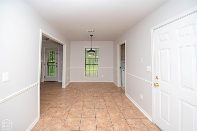2209 Greensboro Rd, Jonesboro, AR 72405 - hallway featuring light tile patterned flooring and baseboards