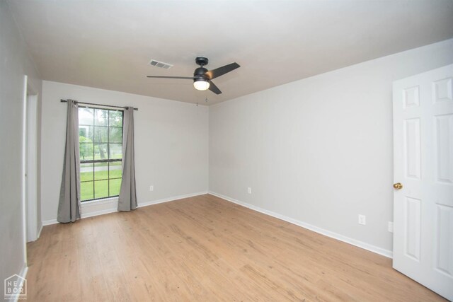2209 Greensboro Rd, Jonesboro, AR 72405 - spare room with ceiling fan, light wood-style flooring, and baseboards