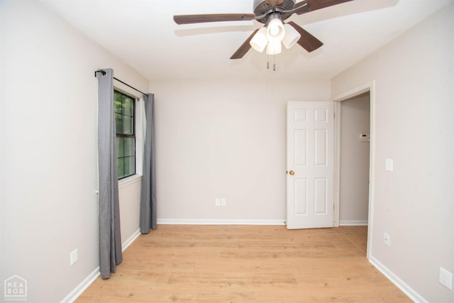 2209 Greensboro Rd, Jonesboro, AR 72405 - empty room with light wood finished floors, ceiling fan, and baseboards