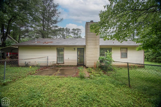 2209 Greensboro Rd, Jonesboro, AR 72405 - back of house with a patio area and a chimney