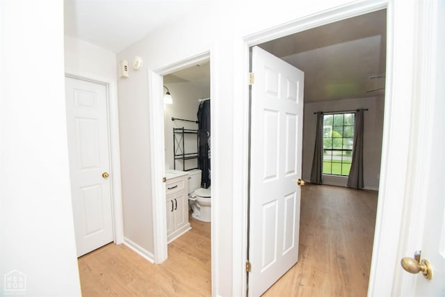 2209 Greensboro Rd, Jonesboro, AR 72405 - hallway with light wood-type flooring and baseboards