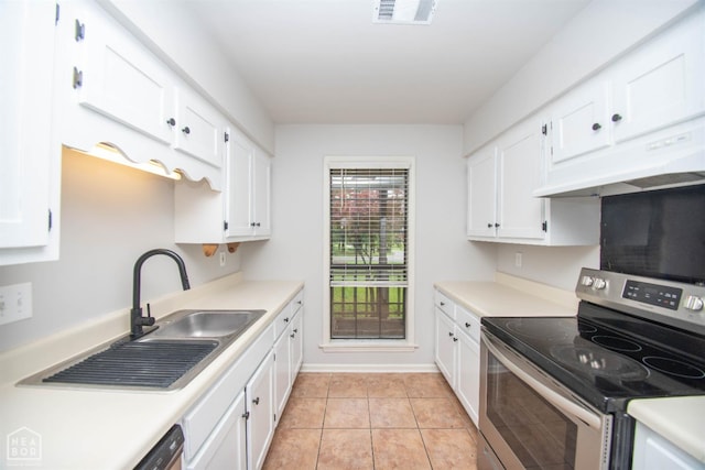 2209 Greensboro Rd, Jonesboro, AR 72405 - kitchen with stainless steel electric range oven, under cabinet range hood, and white cabinetry