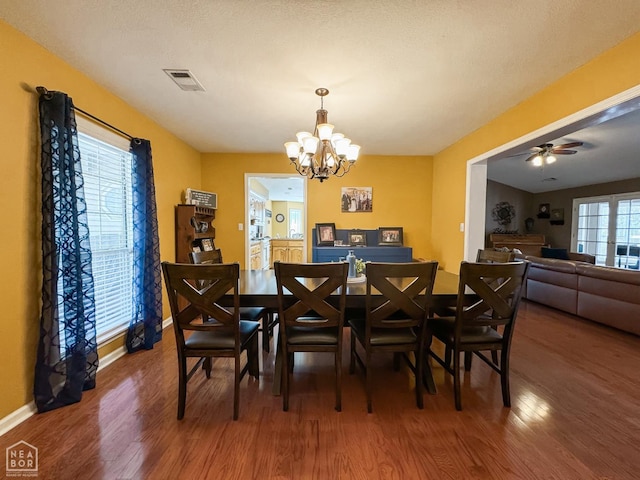 2311 Bridger Rd, Jonesboro, AR 72405 - dining room with wood finished floors, a chandelier, and ceiling fan