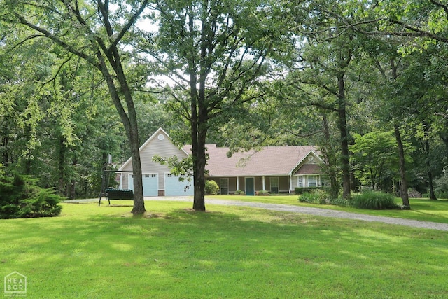 2311 Bridger Rd, Jonesboro, AR 72405 - ranch-style house featuring a front yard, an attached garage, and driveway