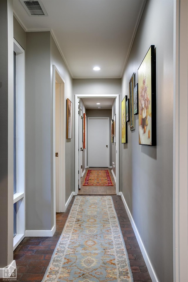 404 E Griffin St, Harrisburg, AR 72432 - corridor featuring dark wood-style flooring, baseboards, visible vents, recessed lighting, and crown molding
