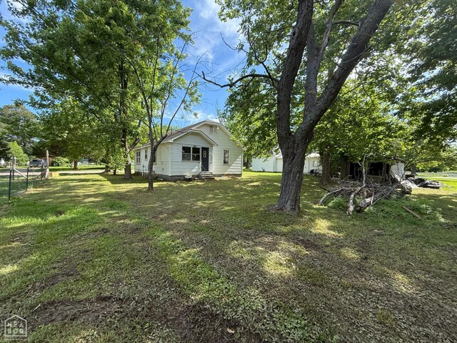 414 E 1st St, Rector, AR 72461 - view of grassy yard with entry steps