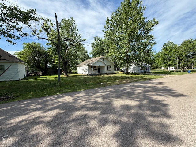414 E 1st St, Rector, AR 72461 - view of side of property featuring a lawn