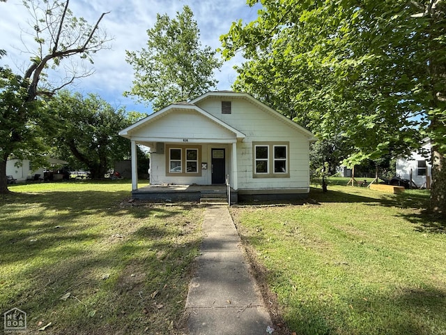 414 E 1st St, Rector, AR 72461 - bungalow-style home featuring covered porch and a front yard