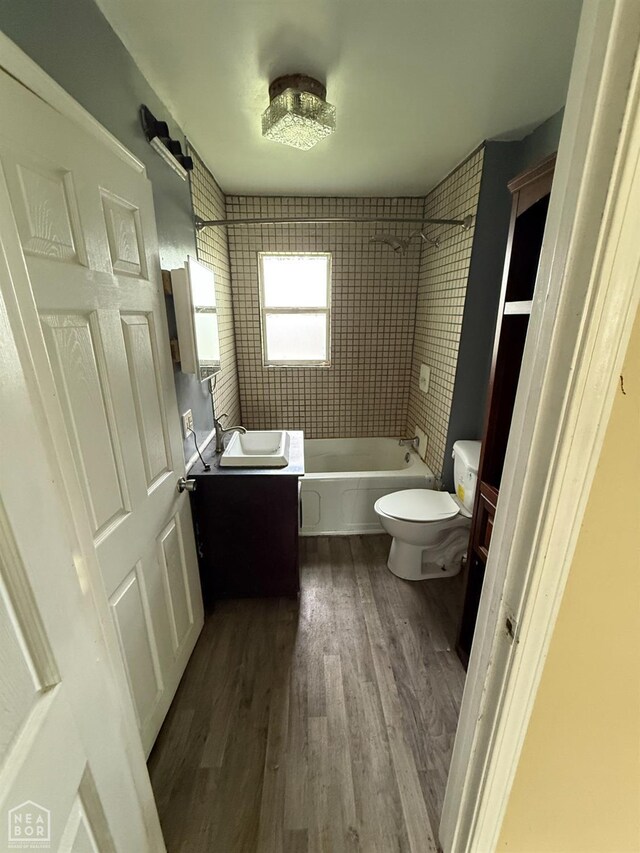 414 E 1st St, Rector, AR 72461 - full bathroom with vanity, wood finished floors, toilet, and  shower combination