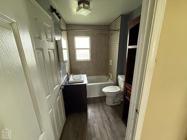 414 E 1st St, Rector, AR 72461 - full bath featuring vanity, toilet, wood finished floors, and shower / bathtub combination