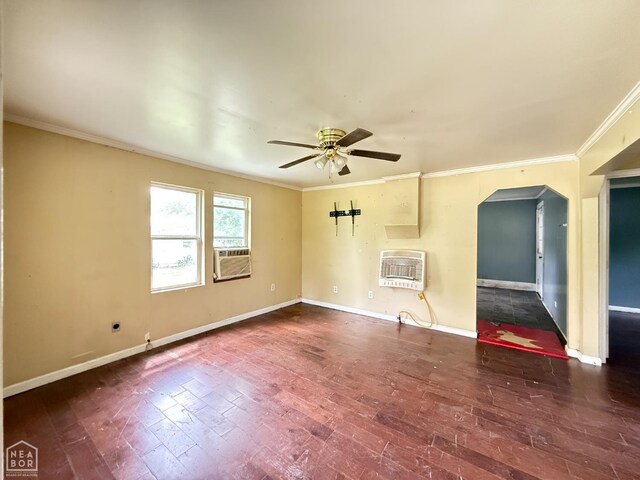 414 E 1st St, Rector, AR 72461 - empty room with heating unit, crown molding, arched walkways, a ceiling fan, and baseboards