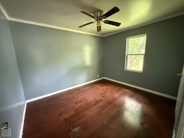 414 E 1st St, Rector, AR 72461 - empty room featuring crown molding, dark wood finished floors, baseboards, and a ceiling fan