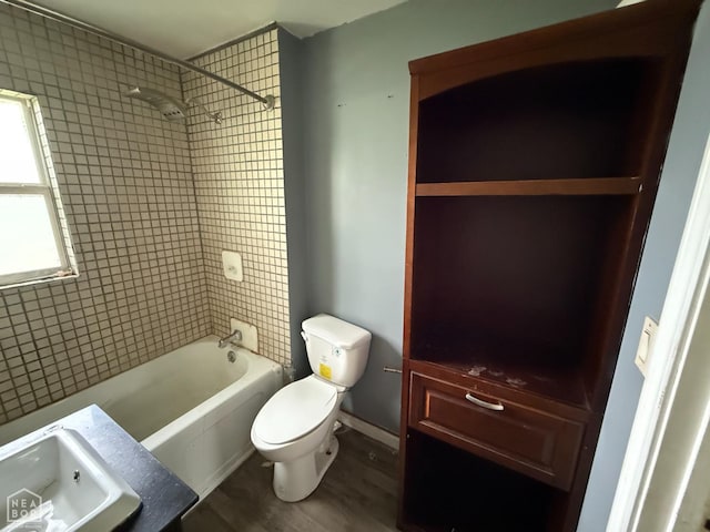 414 E 1st St, Rector, AR 72461 - bathroom with toilet, shower / washtub combination, wood finished floors, and a sink