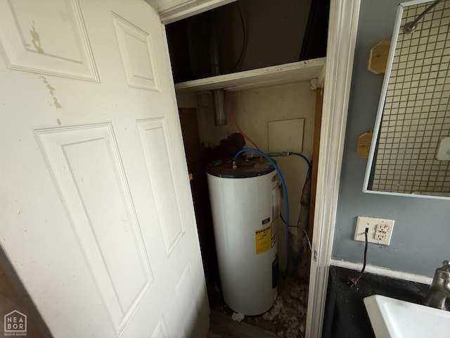 414 E 1st St, Rector, AR 72461 - utility room featuring electric water heater and a sink