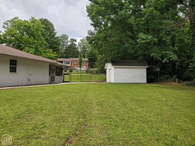 800 Hilltop Dr, Piggott, AR 72454 - view of yard with a storage shed, an outdoor structure, a carport, and view of scattered trees