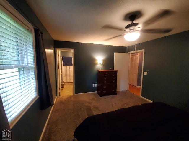 800 Hilltop Dr, Piggott, AR 72454 - bedroom featuring carpet, baseboards, ceiling fan, and ensuite bath