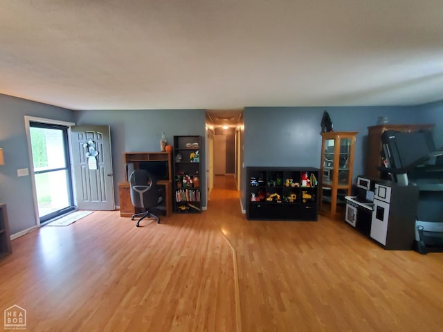 800 Hilltop Dr, Piggott, AR 72454 - living room with wood finished floors and an office area