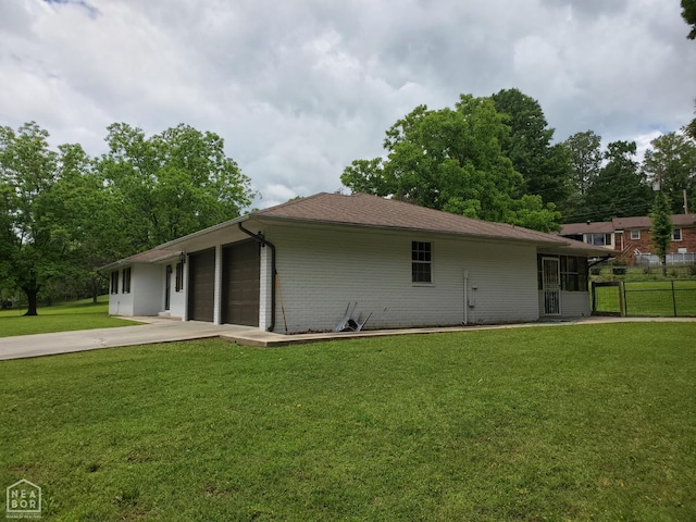 800 Hilltop Dr, Piggott, AR 72454 - view of property exterior with a garage and driveway