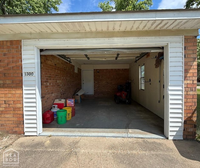 garage featuring aphalt driveway