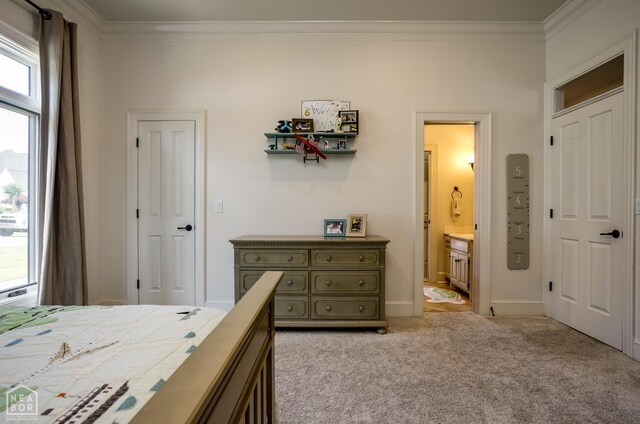 1203 Dove Rd, Jonesboro, AR 72401 - bedroom with crown molding, light carpet, baseboards, and ensuite bathroom