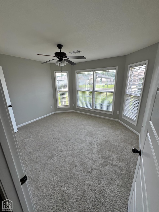 206 Gavin Dr, Paragould, AR 72450 - carpeted empty room with baseboards and a ceiling fan