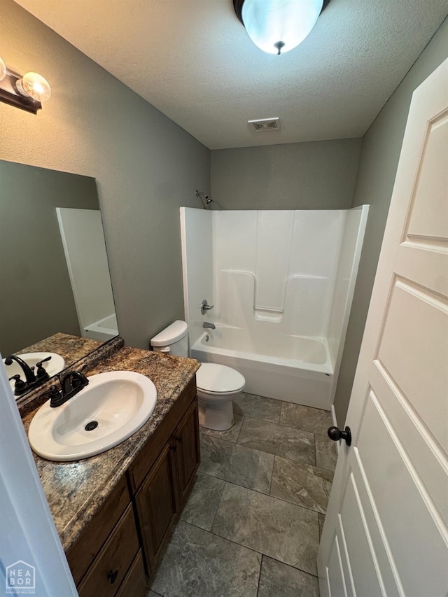 206 Gavin Dr, Paragould, AR 72450 - full bathroom featuring vanity, tub / shower combination, and a textured ceiling