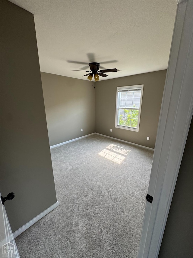 206 Gavin Dr, Paragould, AR 72450 - carpeted spare room featuring baseboards and ceiling fan
