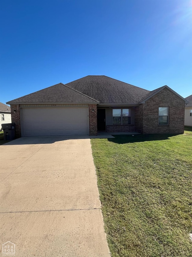 3812 Keeneland Dr, Jonesboro, AR 72404 - ranch-style home featuring brick siding, an attached garage, concrete driveway, and a front yard