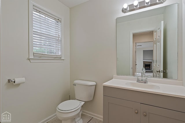 4604 Stillwater, Jonesboro, AR 72404 - half bathroom featuring toilet, baseboards, and vanity