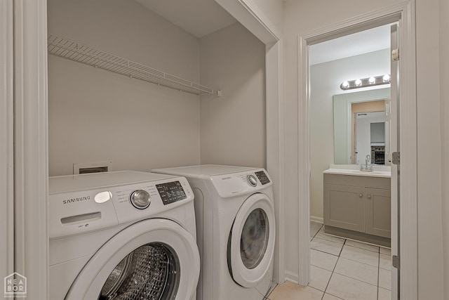 4604 Stillwater, Jonesboro, AR 72404 - washroom with washer and clothes dryer and light tile patterned flooring