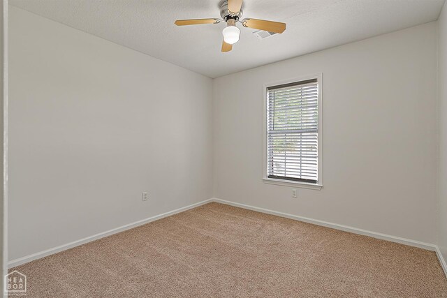 4604 Stillwater, Jonesboro, AR 72404 - spare room featuring carpet, baseboards, and ceiling fan