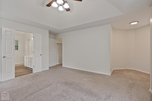 4604 Stillwater, Jonesboro, AR 72404 - unfurnished bedroom featuring carpet floors, baseboards, connected bathroom, and a ceiling fan