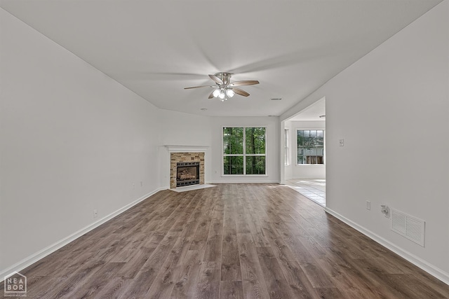 4604 Stillwater, Jonesboro, AR 72404 - unfurnished living room with a ceiling fan, wood finished floors, baseboards, and a fireplace