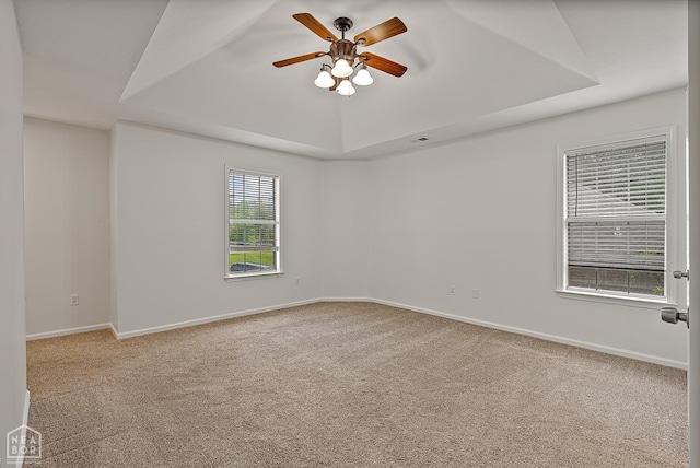 4604 Stillwater, Jonesboro, AR 72404 - unfurnished room featuring a raised ceiling, carpet flooring, a ceiling fan, and baseboards