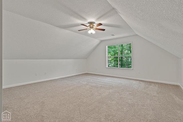 4604 Stillwater, Jonesboro, AR 72404 - bonus room with a textured ceiling, a ceiling fan, carpet floors, baseboards, and lofted ceiling