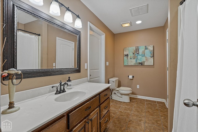 5007 S 28th St, Paragould, AR 72450 - bathroom featuring vanity, toilet, baseboards, and tile patterned floors