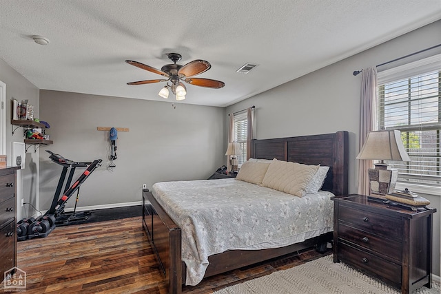 5007 S 28th St, Paragould, AR 72450 - bedroom featuring wood finished floors, baseboards, ceiling fan, and a textured ceiling