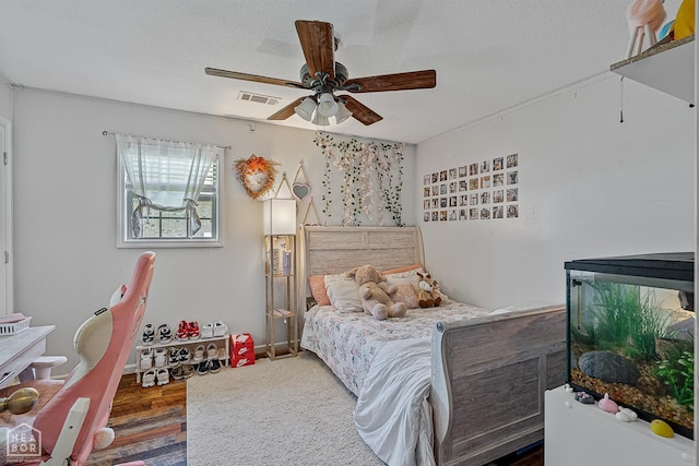 5007 S 28th St, Paragould, AR 72450 - bedroom with ceiling fan, wood finished floors, and a textured ceiling