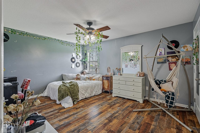 5007 S 28th St, Paragould, AR 72450 - bedroom with wood finished floors, a textured ceiling, and a ceiling fan