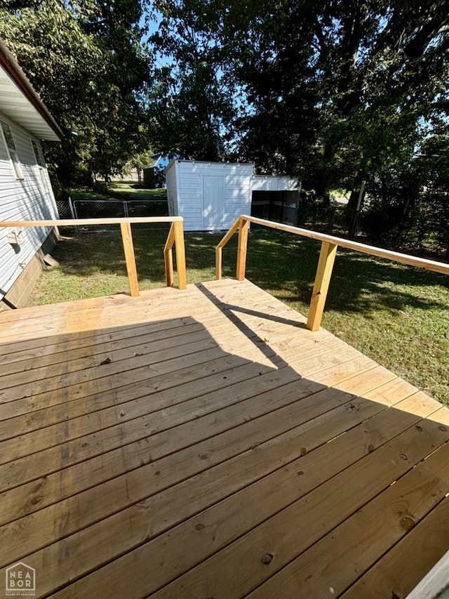 411 S Greenville St, Rector, AR 72461 - deck featuring a storage shed and an outbuilding