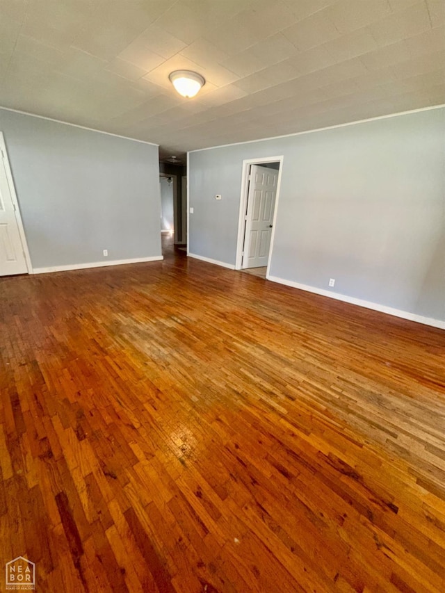 411 S Greenville St, Rector, AR 72461 - empty room featuring baseboards and dark wood finished floors