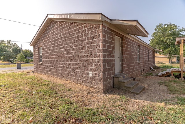 2209 Central St, Jonesboro, AR 72401 - view of property exterior with entry steps and concrete block siding