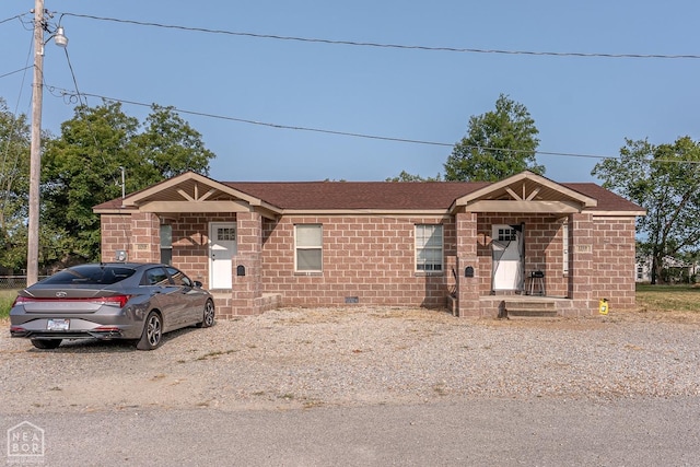 2209 Central St, Jonesboro, AR 72401 - view of front of home featuring brick siding and roof with shingles