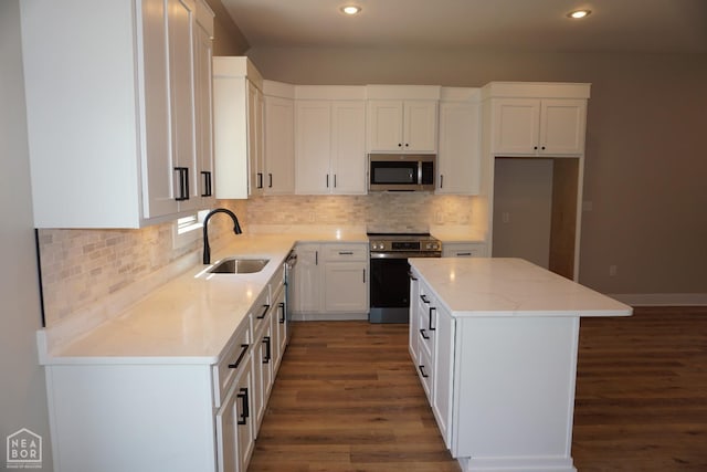 4312 Trailwater Dr, Jonesboro, AR 72404 - kitchen featuring stainless steel appliances, a sink, dark wood finished floors, recessed lighting, and light stone counters