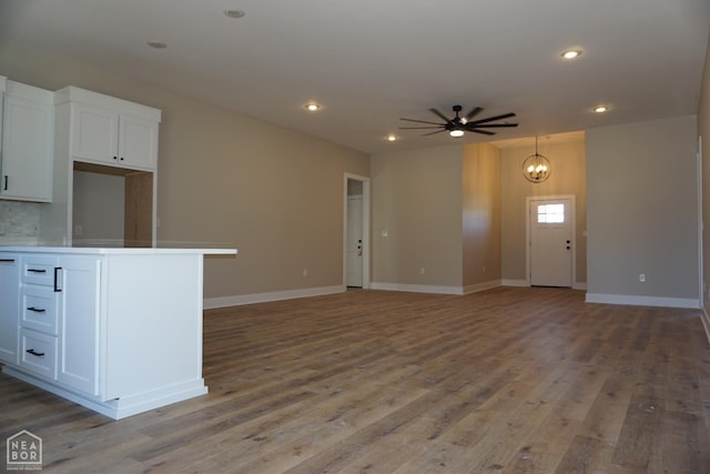 4312 Trailwater Dr, Jonesboro, AR 72404 - unfurnished living room featuring a ceiling fan, light wood finished floors, recessed lighting, and baseboards